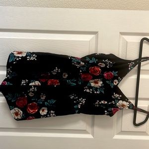 Women’s black floral romper with adjustable straps.  Brand new, never worn.